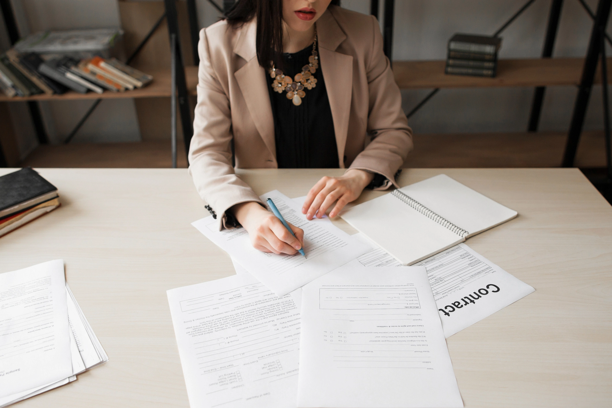 Businesswoman signing contract. Cropped image of female chief, writting on papers. Successful woman, feminist concept